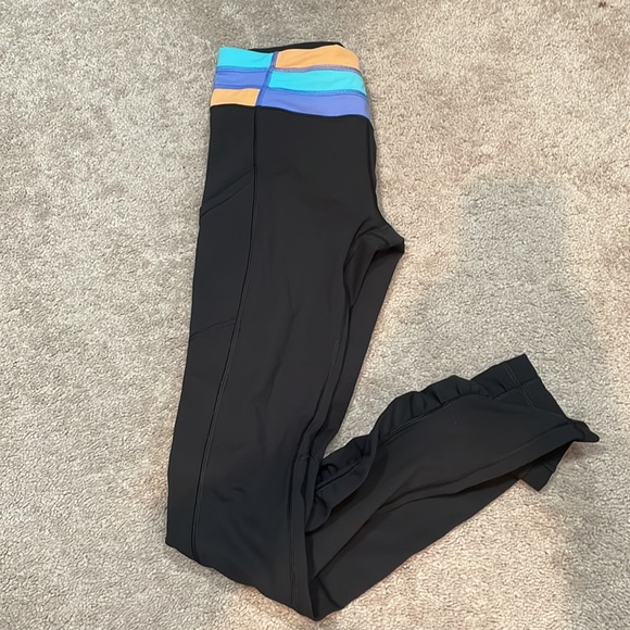 Size 2 Lululemon black pants with side pockets. - Picture 5 of 5